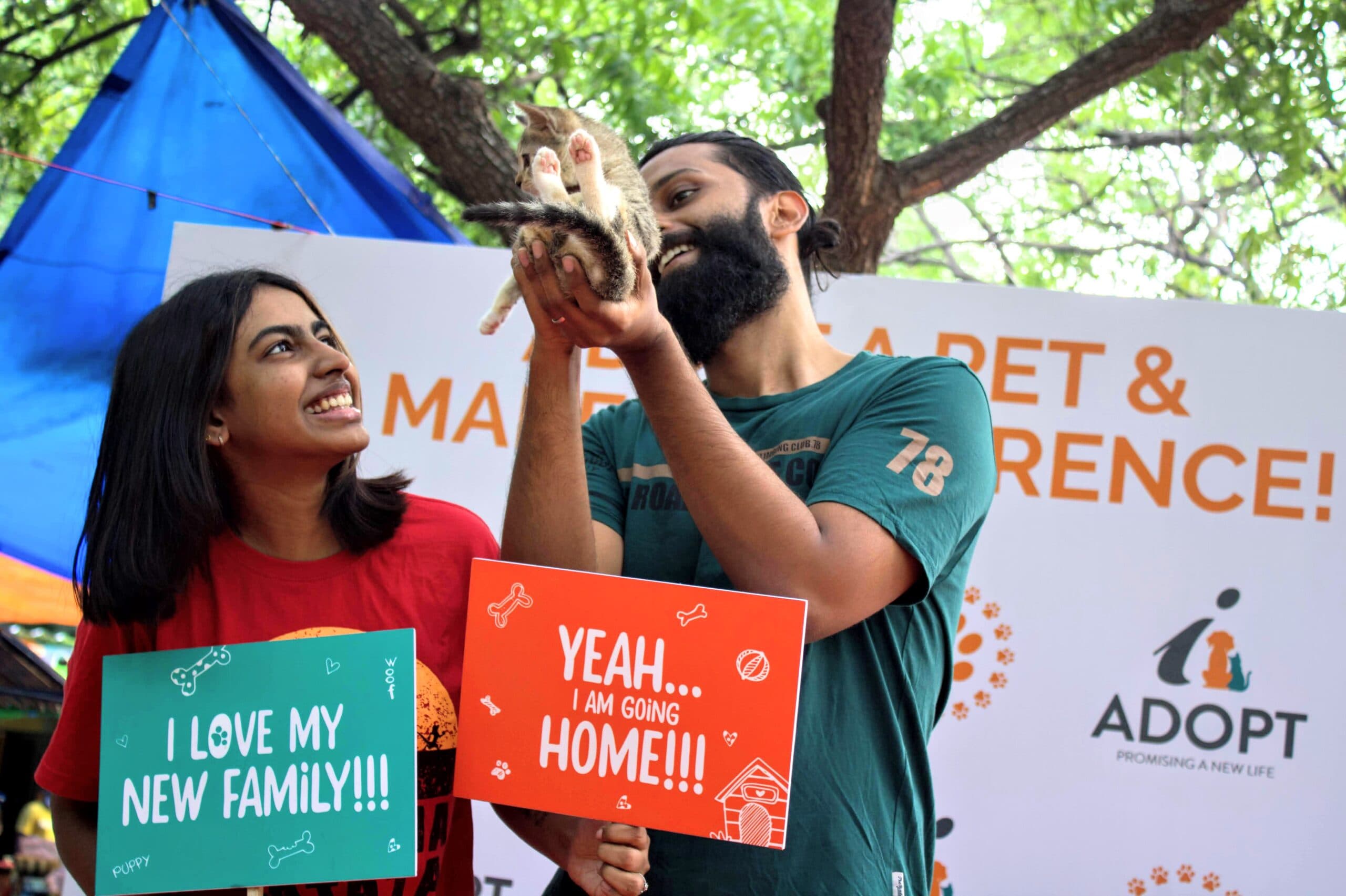 iAdopt volunteers celebrating a rescued kitten finding a home